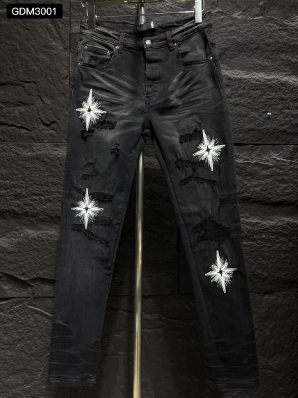 Star-embroidered black jeans